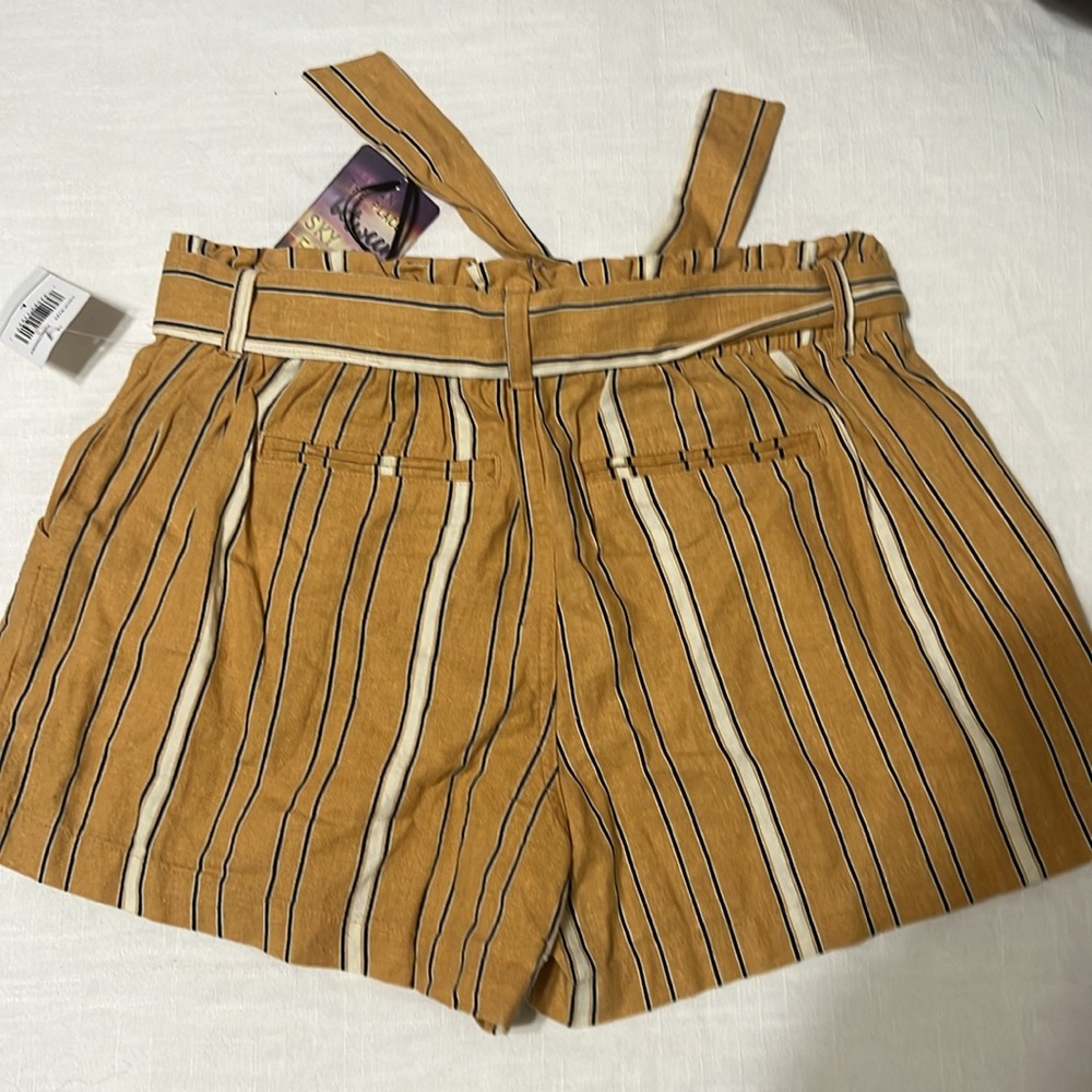 Gold color with a black and cream  stripes size large juniors, 3 inch inseam